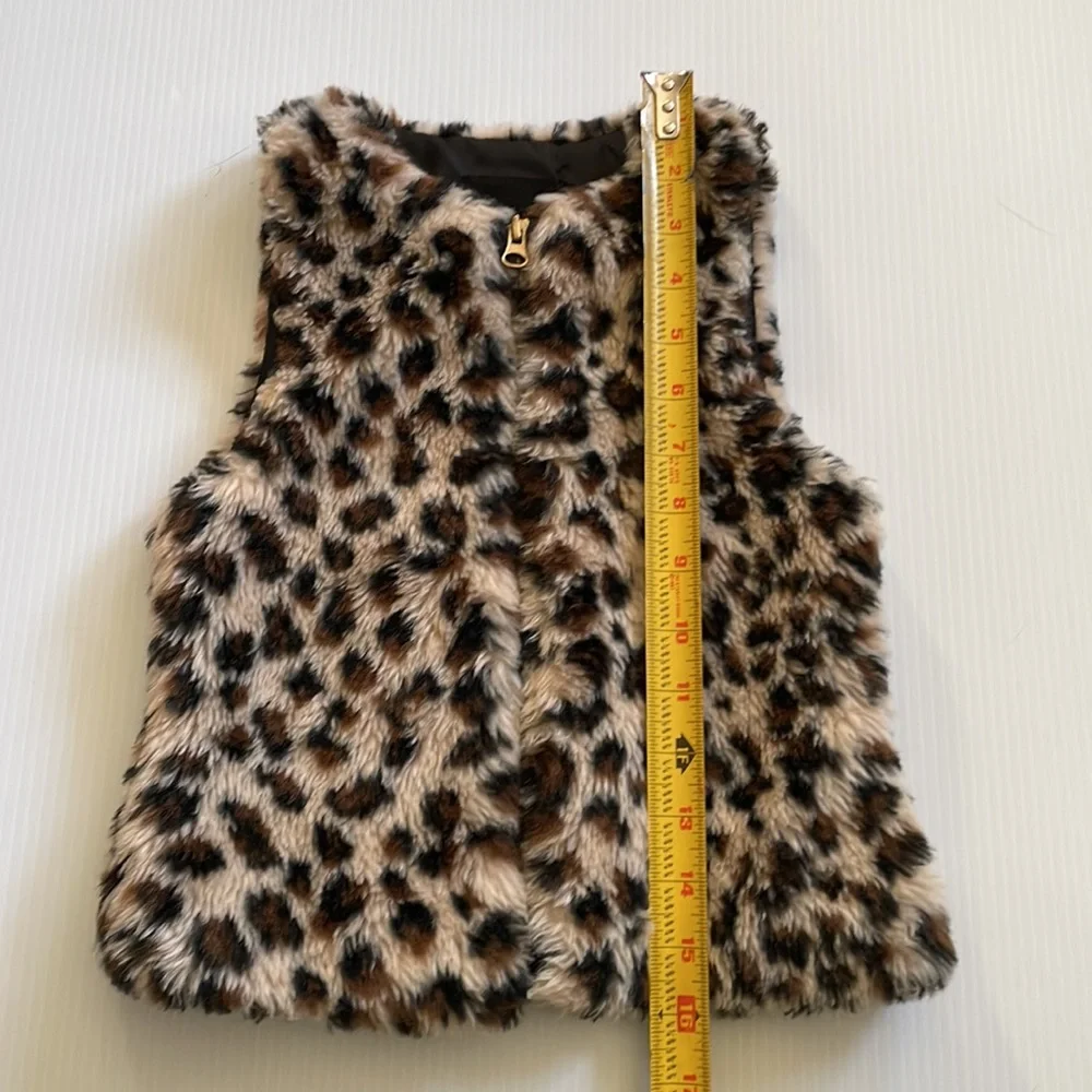 Me Jane black, brown & tan faux fur vest.  Girl’s size 7